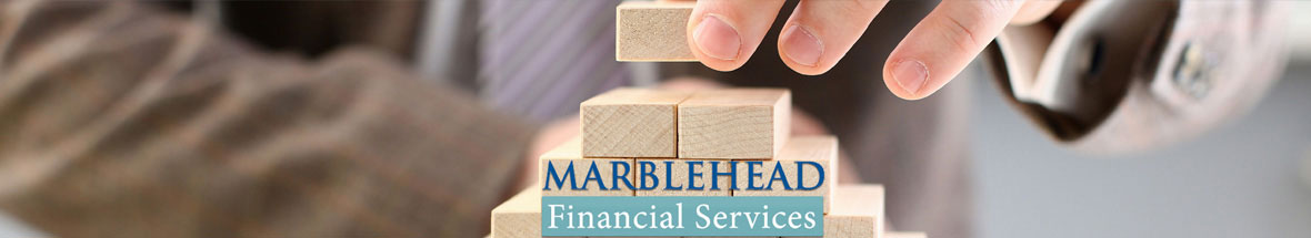 man stacking wooden blocks with the Marblehead Financial Services logo in front